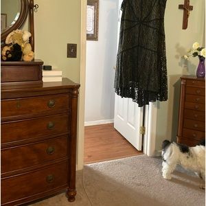 A brand new black dress with tags attached